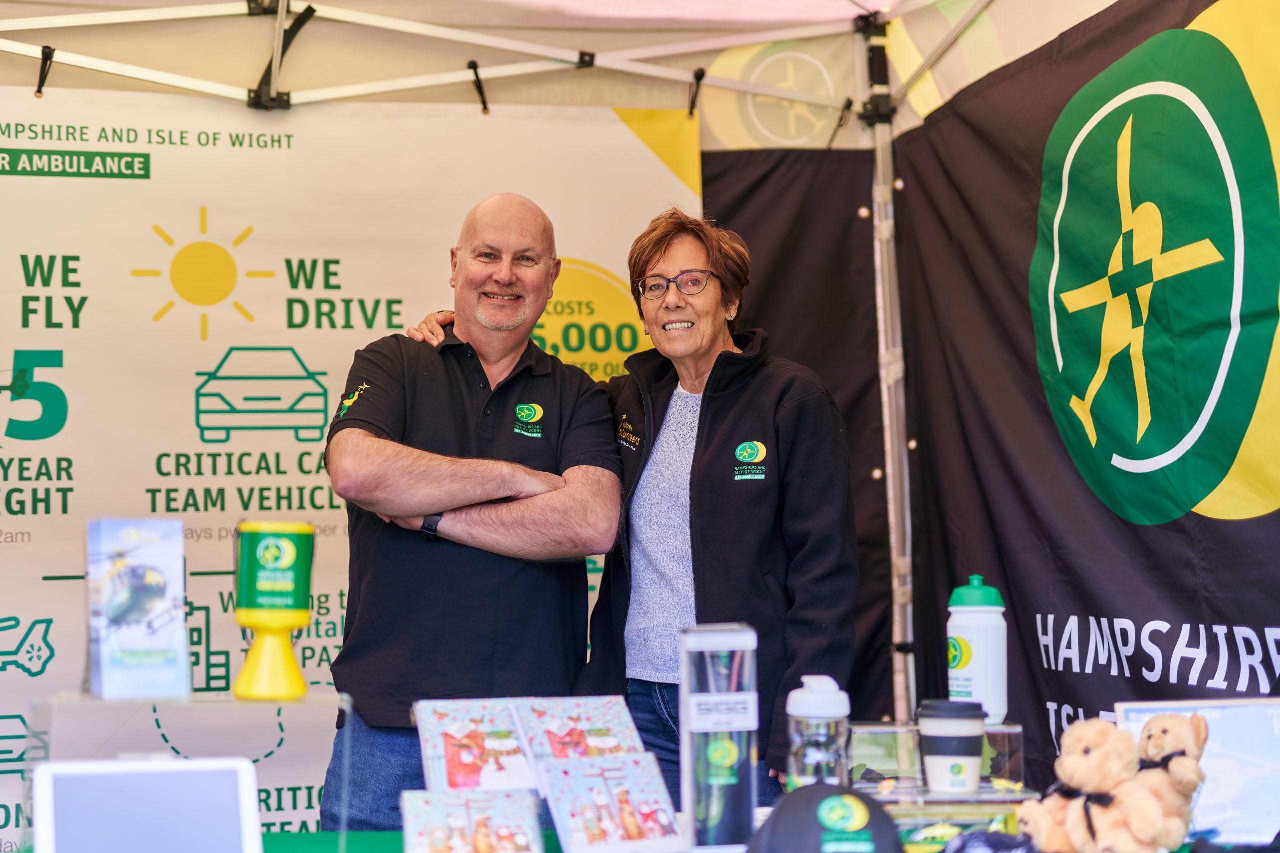 Volunteers helping to man a fundraising stall